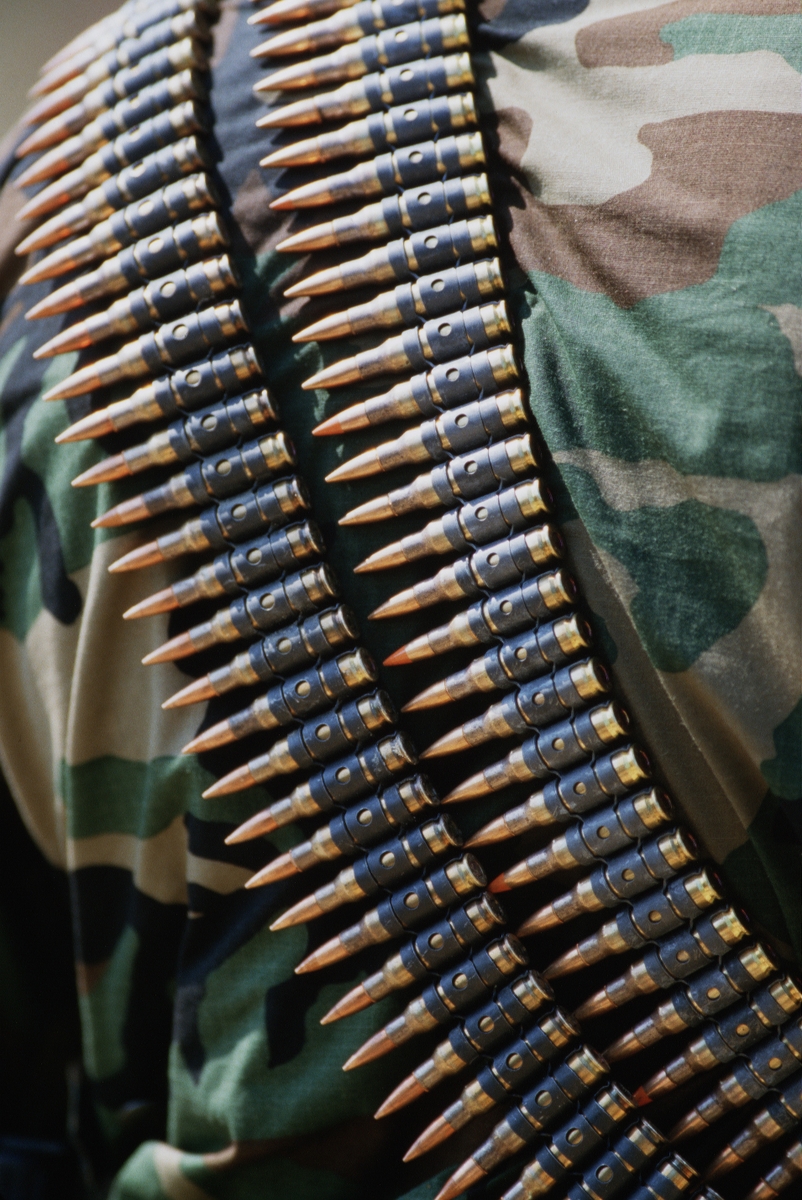 A close-up view of an M60 7.62 mm ammunition belt on the back of a Sea-Air-...